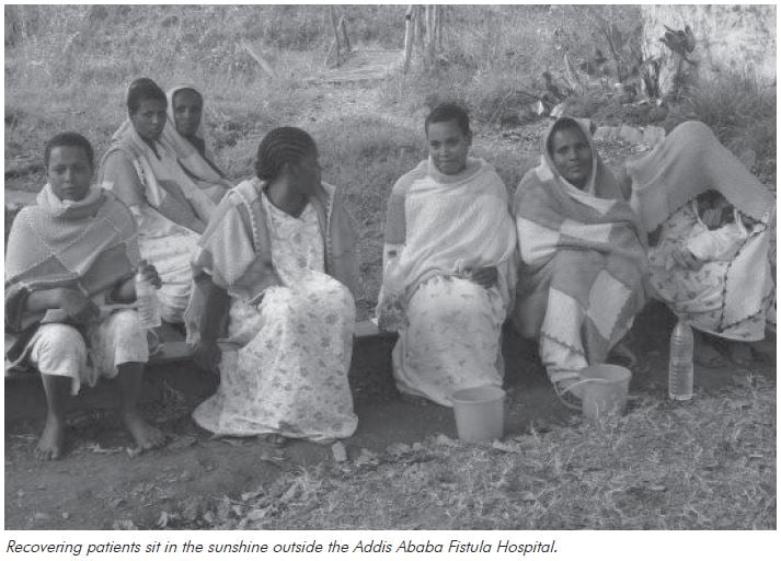Training in Ethiopia: Recovering patients sit in the sunshine outside the Addis Ababa Fistula Hospital