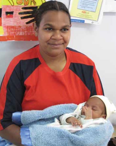 Kadel with his mother, who accessed antenatal care at GRAMS.